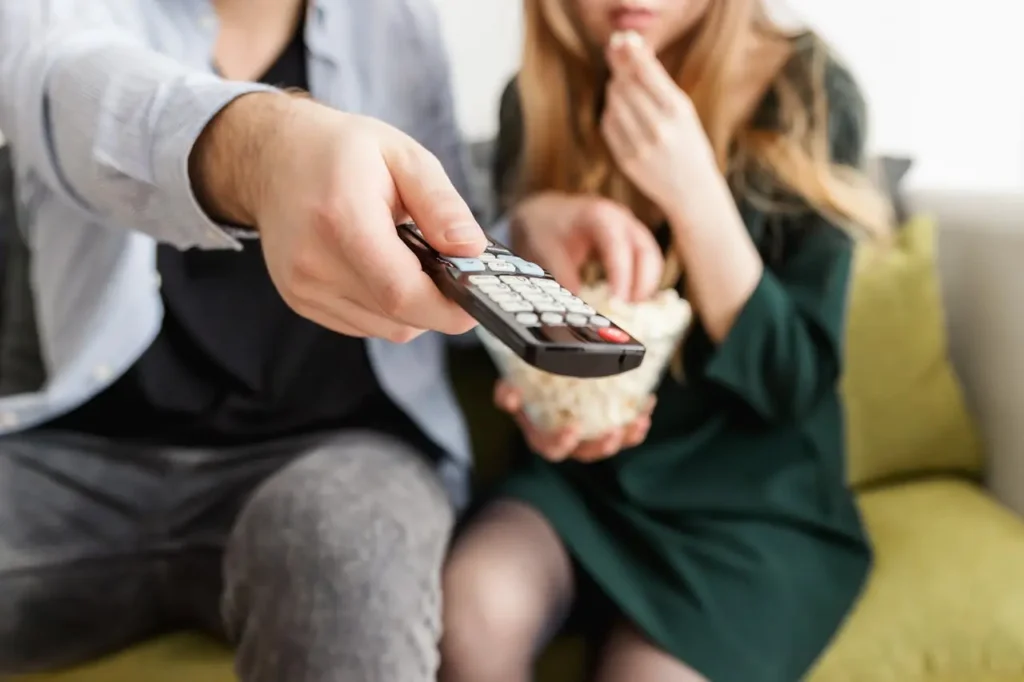 happy couples watching tv